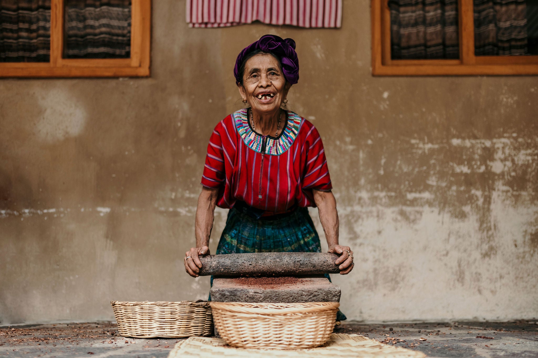 A Women grinding beans