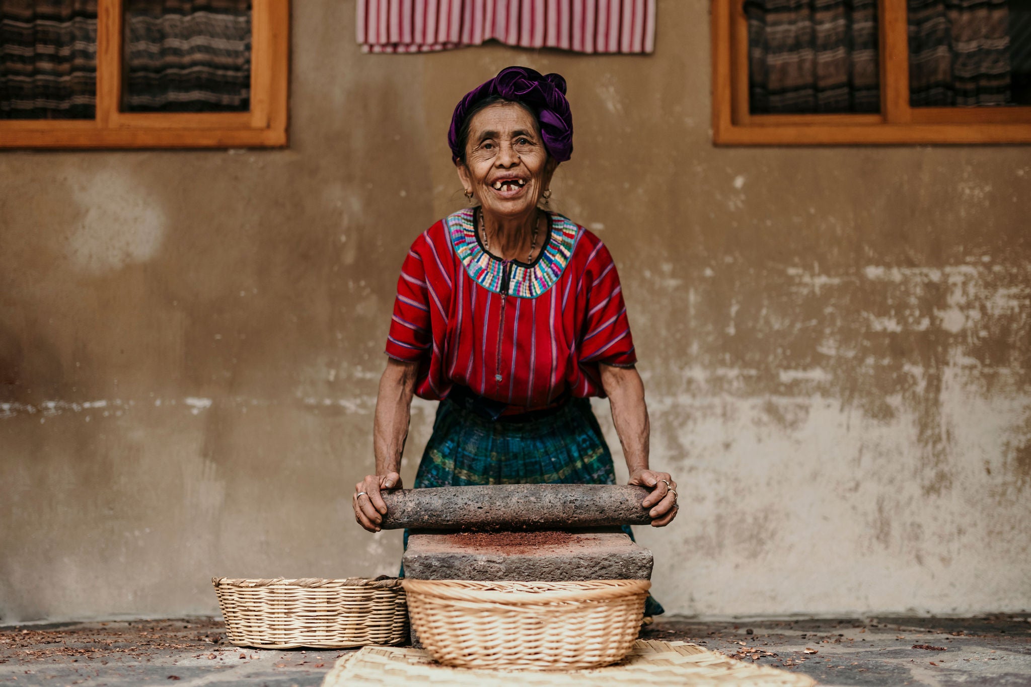 A Women grinding beans